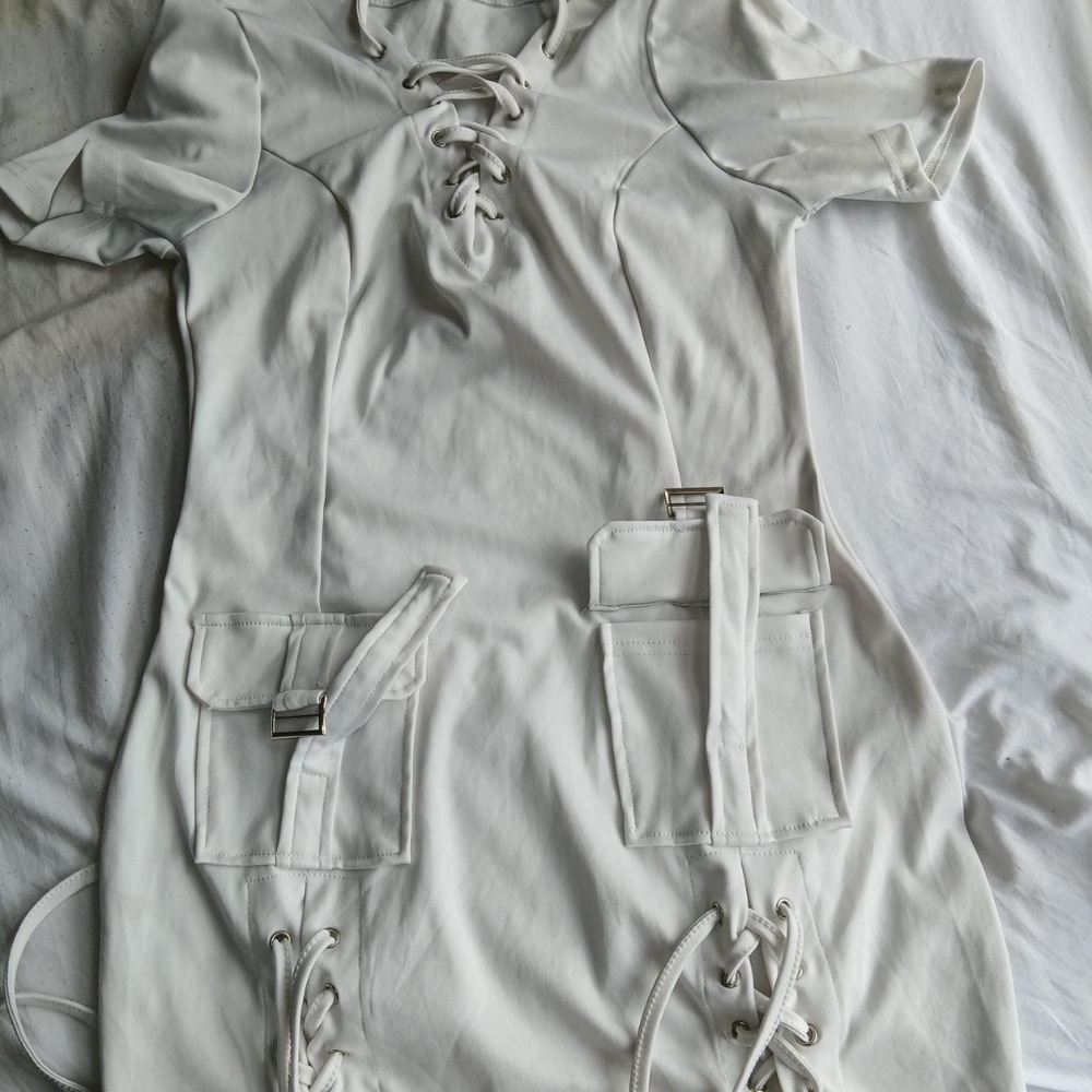 White short lace up bodycon dress with adjustable straps and pocket